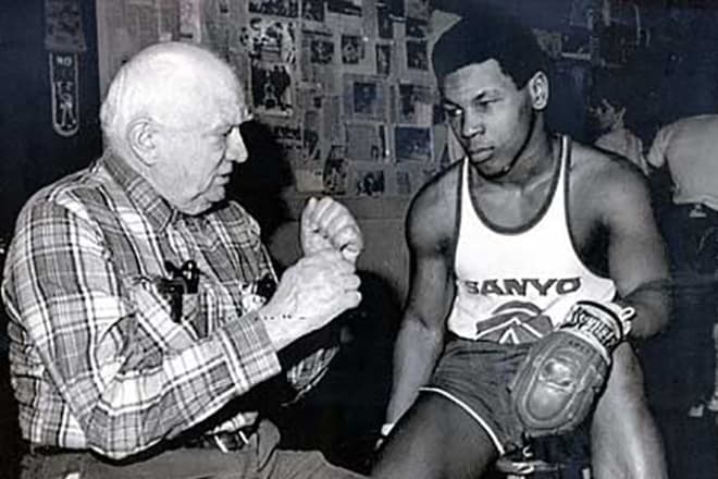 Young Mike Tyson with the coach