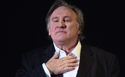 Жерар Депардье избежал суда за драку с «королем папарацци»